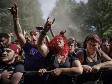 Fans enjoy the performance by the American metalcore band Memphis May Fire on Day Two of the Heavy Montréal music festival at Jean-Drapeau Park in Montreal on Sunday, August 7, 2016.