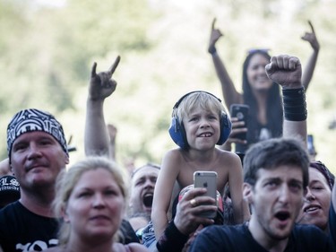 Music fans watch the performance by American musician Zakk Wylde on Day Two of the Heavy Montréal music festival at Jean-Drapeau Park in Montreal on Sunday, August 7, 2016.