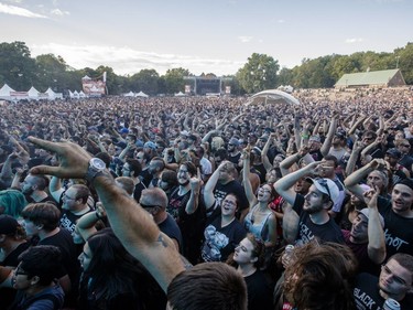 Music fans enjoy the performance by Black Label Society on Day One of the Heavy Montréal music festival at Jean-Drapeau Park in Montreal on Saturday, August 6, 2016.