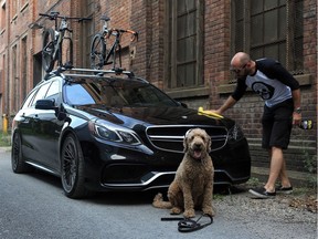 Hoosier the Aussie Labradoodle anxiously awaits to jump in the back of the wagon. Bikes on the roof means that owner Chris Rouleau is taking him to a trail for some off-leash running.
(Photo by Paul Labonté)