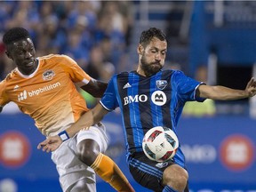 Montreal Impact's Matteo Mancosu, right, challenges Houston Dynamo's Jalil Anibaba during second half MLS soccer action in Montreal, Saturday, Aug. 6, 2016.