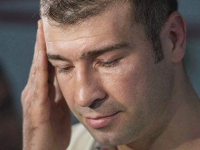 Boxer Lucian Bute speaks to reporters in Montreal, Friday, May 27, 2016, following a drug test where he tested positive for a banned substance. Former boxing champion Lucian Bute said a supplement he took to help him sleep contained the banned substance Ostarine and led to his positive doping test.