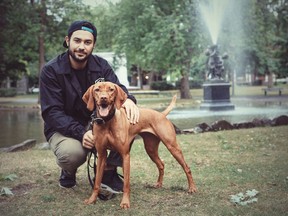 Lucy the Vizsla and owner Philip Tabah squatting by the pond at Outremont Park.
(Photo by Paul Labonté)