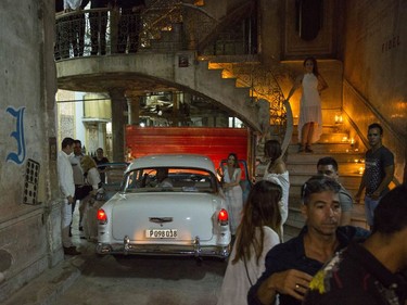 Madonna, left, gets out of a classic American car at a restaurant where she was celebrating her 58th birthday in Havana, Cuba, Tuesday, Aug. 16, 2016.