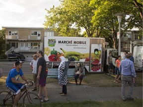 Residents were on hand at Painter Park, where Relais Laurentien inaugurated a project of roving grocery markets that will visit neighbourhoods in the St-Laurent borough of  Montreal, Monday August 1, 2016.