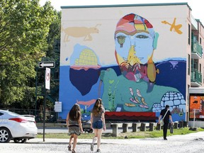 Large mural on the side of a building on Ontario St. E. in Montreal Wednesday August 10, 2016 created by four Inuit artists, teenagers from Nunavut.