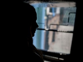 Nineteen year-old John Abbott College student Emily, not her real name, poses for a photograph in Montreal on Thursday, August 11, 2016. The 19 year-old woman says that she was sexually assaulted by a fellow student and member of the football team and that police and school administration have not taken her case seriously enough.