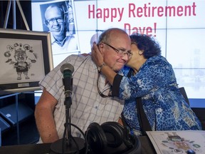 Dave Fisher gets a hug and kiss from his wife Ardy, after signing off after broadcasting his last show, after 32 years hosting weekend mornings in Montreal on CJAD, Sunday, August 14, 2016.