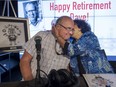 Dave Fisher gets a hug and kiss from his wife Ardy, after signing off after broadcasting his last show, after 32 years hosting weekend mornings in Montreal on CJAD, Sunday, August 14, 2016.