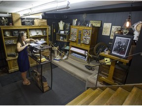 Marketing manager Cristine Tessier prepares items for display in a museum at the basement of G. D'Aoust & Cie department store in Ste-Anne-de-Bellevue. The museum traces the 116 year-old store's history and is open to the public. (Phil Carpenter / MONTREAL GAZETTE)