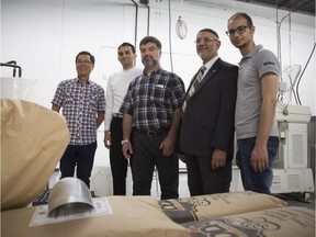 ( Left to Right) Le Khac Hung, plant engineer, Mohsin Youssef, plant president, Fadil Mofti, a Syrian refugee, Mehmet Deger, president of the Dorval Mosque, and Mohammad Shabban, another Syrian refugee, at Amount foods bread factory in Montreal. Deger has recently opened  this factory in Lachine that employs Syrian refugees upon arrival.