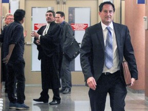 Former Montreal mayor Michael Applebaum leaves court during a recess at the Palais de Justice in Montreal Monday, Aug. 22, 2016.