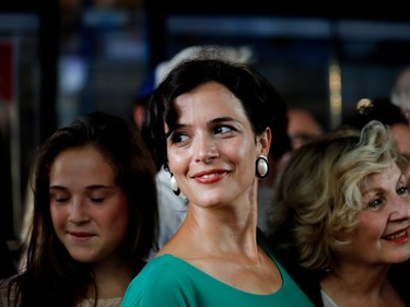 Catherine de Léan, who plays Mignonne, poses on the red carpet outside the Imperial Cinema Thursday, Aug. 25, 2016 for the première of Quebec director André Forcier's Embrasse-moi comme tu m'aimes, the opening film of the Festival des films du monde.