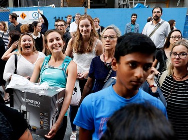 Movie fans and passersby get a view of the red carpet outside the Imperial Cinema Thursday, Aug. 25, 2016 for the première of Quebec director André Forcier's Embrasse-moi comme tu m'aimes, the opening film of the Festival des films du monde.