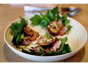 The duck “ham” was whole duck that was cured, smoked, sliced and served with a garnish of plums and peppers on a bed of celery leaves.