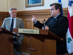Montreal Mayor Denis Coderre, right, met with Laurent Lessard, the newly appointed minister of transport, at Montreal city hall on Friday, August 26, 2016.