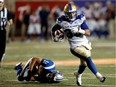 Montreal Alouettes linebacker Chip Cox falls to the turf after failing to stop Winnipeg Blue Bombers running back Andrew Harris during CFL action at Molson Stadium in Montreal on Friday August 26, 2016. Harris scored a touchdown on the play.