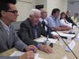 The mayor of Lanoraie, Gérard Jean, second from left,  speaks next to other Quebec regional mayors, during press conference to show their opposition to Bill 106, while in Montreal on Friday August 26, 2016.