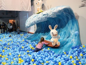 A child plays in the pool ball at Lapins Crétins Amusement Centre on August 27, 2016.  Ubisoft, the giant video-game developer, opened its first Canadian family entertainment centre aimed at kids under the age of 12.