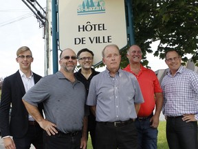 The six candidates running in a by-election in St-Lazare stands by the town hall sign in St-Lazare on August 28, 2016. Left to right: Hugo Castonguay, Paul Lavigne, Alvaro Martinez, Marc-André Esculier, Michel Lambert et Martin Couture, (Marie-France Coallier/ MONTREAL GAZETTE)