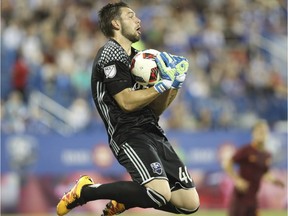 Goalie Maxime Crepeau of the Montreal Impact makes a save in the second half of an international friendly soccer game Wednesday, August 3, 2016 against Italian club AS Roma at Saputo stadium in Montreal.