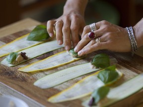 Montreal nutrition practitioner and food consultant Danielle Levy prepares summer zucchini rolls. Ingredients include garlic white bean filling, Kalamata olives and fresh basil.