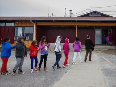 2013: School children, wearing bright colours and comfy hoodies, stand in line to return to school at the Niska elementary school in the First Nation reserve of Opitciwan, 600 kilometres north of Montreal.