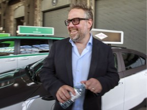 Alexandre Taillefer, Taxelco founder, laughs after finishing an interview at a press conference announcing Taxelco's purchase of Diamond Taxi in Montreal, Tuesday August 9, 2016. (John Mahoney}