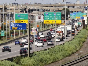 Eastbound Highway 20 traffic heads through the Turcot Yards in Montreal Monday July 11, 2016.  Elevated portions of Highway 15 are at top of photo.