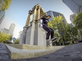 Étienne Deshaies performs tricks on the monument to Sir John A. Macdonald, Canada's first prime minister, in Place du Canada. Critics say skateboarders are damaging public property.