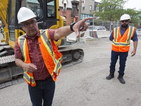 Fernando Rivera, left, and Jean-Luis Cantero explain the workflow of the construction on the St-Denis St. project on Thursday July 28, 2016.