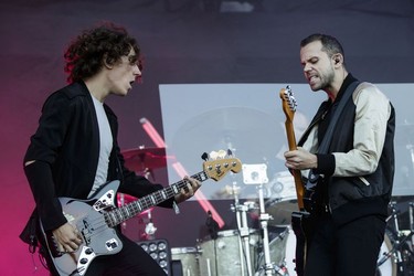 Jordan Lawlor, left, and Anthony Gonzalez, right, of the French electronic music group M83 perform on day three of the Osheaga Music Festival at Jean-Drapeau Park in Montreal on Sunday, July 31, 2016.