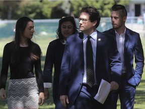 Former Marie-Victorin MNA Bernard Drainville, in Longueuil on Monday, June 14, 2016, on his way to a news conference (with, from the left: daughter Rosalie, wife Martine Forand and son Lambert) where he announced that he was leaving politics.