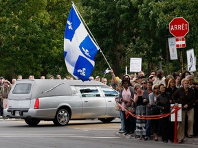 Mourners gather on Sept. 10, 2012 in Montreal for the funeral of Denis Blanchette, the stagehand who was killed by Richard Henry Bain.