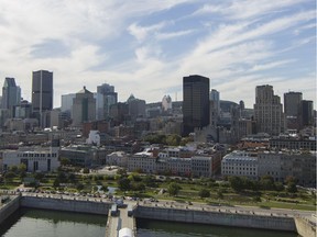MONTREAL, QUE.: SEPTEMBER 21, 2015 -- STK -- A view of the city of Montreal Monday, September 21, 2015. In the foreground is the rue de la Commune area of Old Montreal. This view is from the Tour  des Convoyeurs on the Quai des Convoyeurs in the Old Montreal area of Montreal. (John Kenney / MONTREAL GAZETTE)