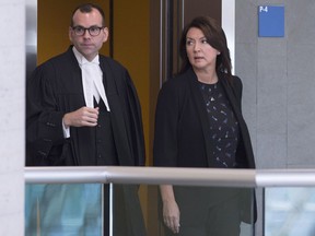 Former Quebec deputy premier Nathalie Normandeau, right, and her lawyer Maxime Roy: the former Quebec deputy premier faces charges of conspiracy, fraud and breach of trust.