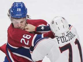 The Columbus Blue Jackets' Nick Foligno lands a solid right to the chin of Canadiens defenceman Nathan Beaulieu during NHL game at the Bell Centre in Montreal on Dec. 1, 2015.