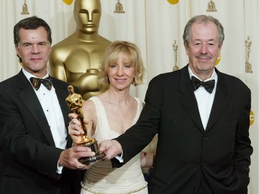 (L-R) Daniel Louis, Denise Robert and Université de Montréal alumni Denys Arcand after winning the Oscar for Best Foreign Film, for Les Invasions Barbares, at the 76th Annual Academy Awards in 2004.