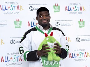Nashville Predators defenceman P.K. Subban hams it up with a stuffed mascot during a news conference in advance of the P.K. Subban All-Star Comedy Gala on Aug. 1, 2016 in Montreal.