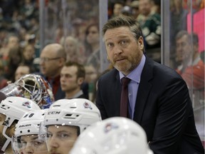 In this Feb. 7, 2015, file photo, Colorado Avalanche head coach Patrick Roy watches from the bench during the third period of an NHL hockey game against the Minnesota Wild in St. Paul, Minn.