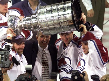 June 9, 2001: Ray Bourque, coach Bob Hartley, Patrick Roy and Joe Sakic of the Colorado Avalanche celebrate defeating the New Jersey Devils to win the Stanley Cup finals at the Pepsi Center in Denver, Colorado. The Avalanche defeated the Devils 3-1 to win the series 4-3.