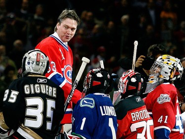 Nov. 22, 2008: Patrick Roy talks to young goalies present to honour him during his retirement ceremony before a game against the Boston Bruins at the Bell Centre.
