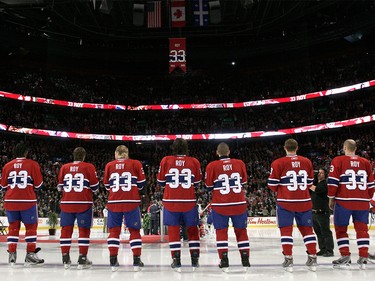 Nov. 22, 2008: Members of the Montreal Canadiens stand watching the #33 banner of Patrick Roy being hoisted to the rafters during the retirement ceremony before a game against the Boston Bruins at the Bell Centre.