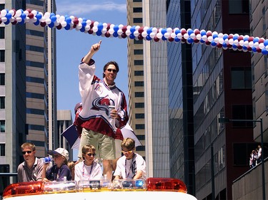 June 11, 2001: Goalie Patrick Roy of the Colorado Avalanche displays number one from atop a fire engine during a parade through downtown Denver, Colorado to celebrate winning the 2001 NHL Stanley Cup Championship.