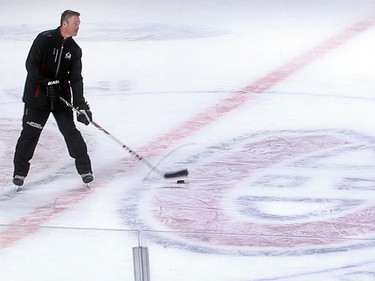 March 17, 2014: Colorado Avalanche head coach Patrick Roy skates next to the Montreal Canadiens crest on centre ice of the Bell centre during team practice (the day before the Avalanche played the Habs).
