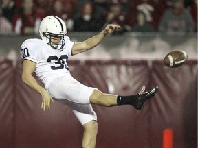 MADISON, WI - NOVEMBER 26:  Anthony Fera #30 of the Penn State Nittany Lions punts the ball against the Wisconsin Badgers at Camp Randall Stadium on November 26, 2011 in Madison, Wisconsin. Wisconsin defeated Penn State 45-7.