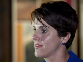 Algerian-born Djemila Benhabib responds to questions during a news conference with PQ leader Pauline Marois on Tuesday, August 14, 2012 in Trois-Rivieres, Que. A slander trial is set to begin next month pitting Benhabib, a fiercely secular, feminist author against a private, Muslim school in Montreal she likened to militant Islamic training camps in Afghanistan and Pakistan.