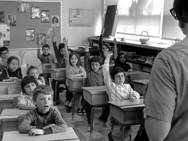 1973: A child in the back takes a power nap while the rest of the students cover for her. Buttoning shirts right to the top was the norm and so was your mom making you wear undershirts under your clothing.