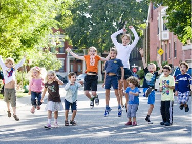 2009: Some of the children who live on Springfield Ave., in Westmount, jump on their street during a back to school party. The printed T-shirt is trending here.