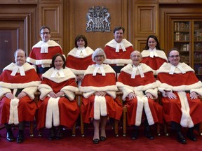 The Supreme Court justices pose for a group photo during the official welcoming ceremony for Supreme Court of Canada Justice Suzanne Cote at the Supreme Court, Tuesday Feb.10, 2015 in Ottawa. Do you want to be a Supreme Court justice? You may have a chance at a seat on the high court if you meet the requirements and criteria to be used in the new selection process.